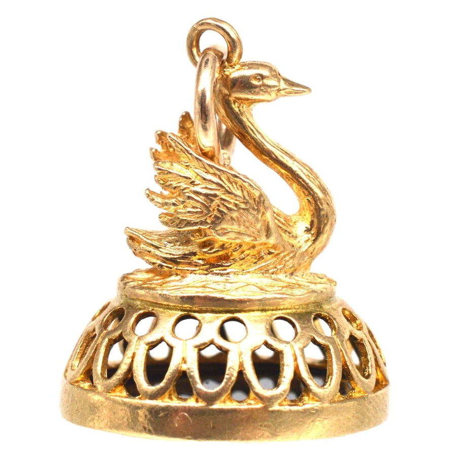 Vintage 9ct gold swan pendant with intricate design and onyx seal of Hermes, showcasing fine craftsmanship.