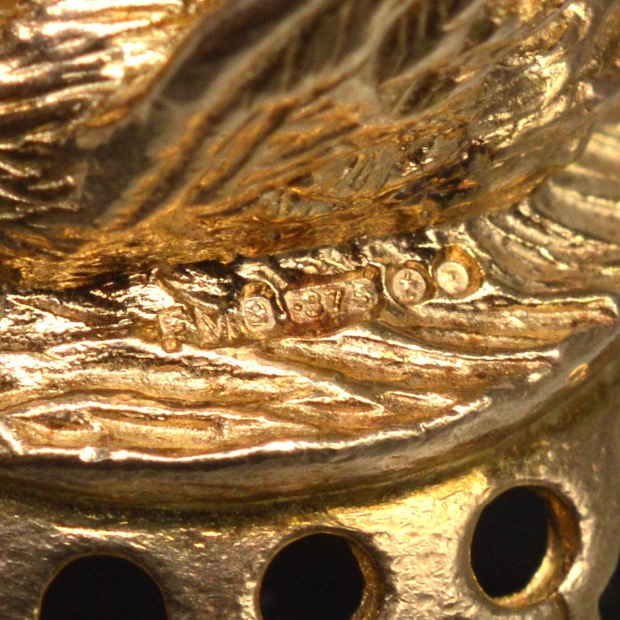 Close-up of hallmark on Vintage 9ct Gold Swan Pendant, showcasing craftsmanship and quality of 9ct gold.
