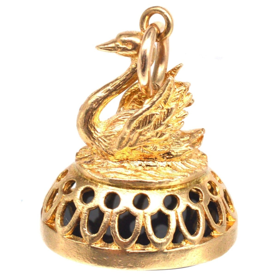 Vintage 9ct gold swan pendant featuring an onyx seal of Hermes, showcasing intricate design and craftsmanship.