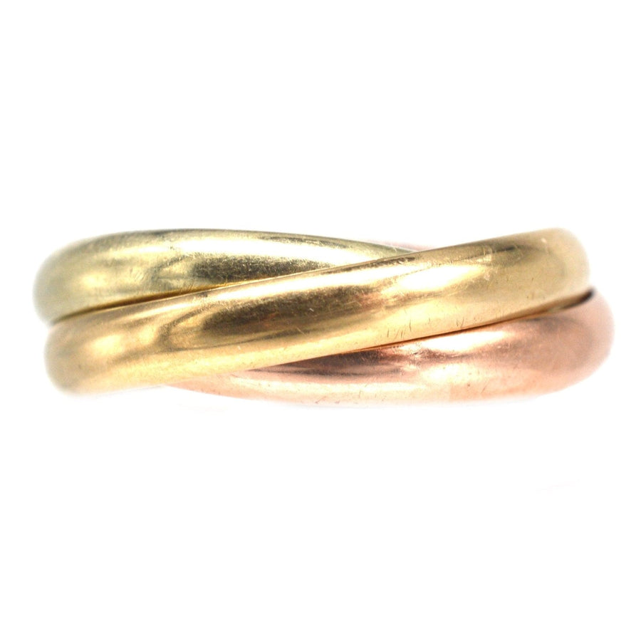 Vintage 9ct gold Trinity ring in three colors, showcasing elegant intertwined design suitable for men and women.