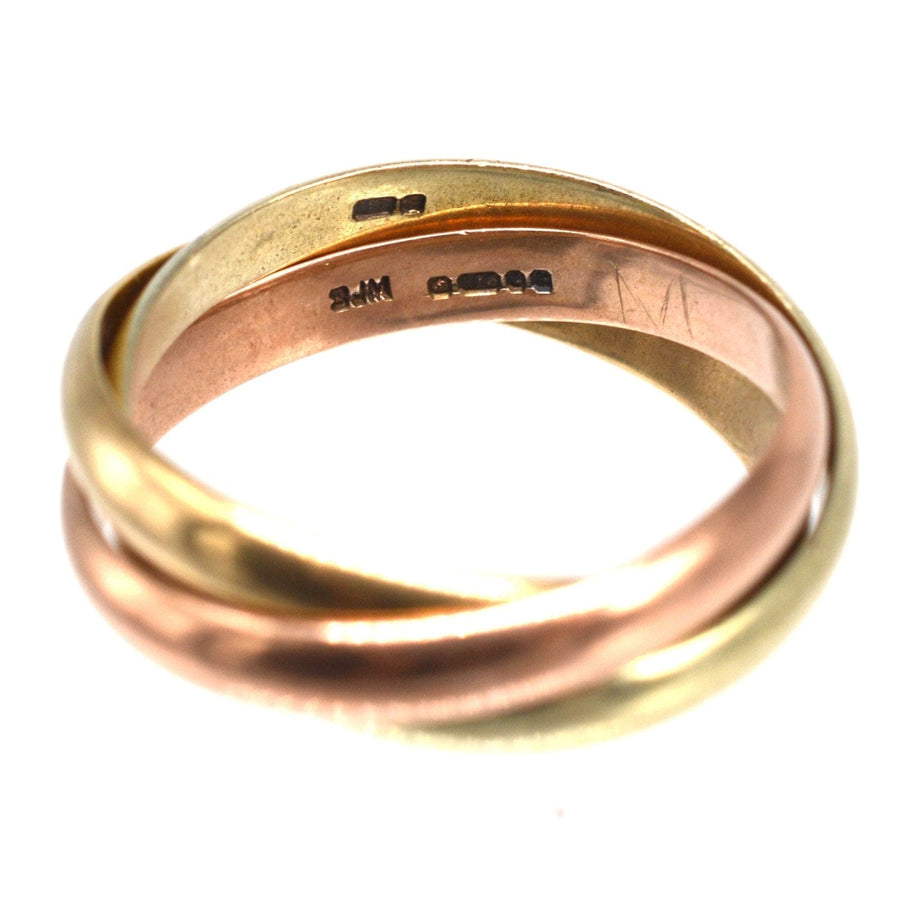 Vintage 9ct gold Trinity ring featuring three intertwined colors: yellow, white, and rose gold, stylish and versatile for all.