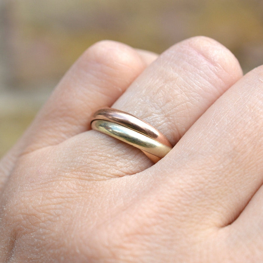 Vintage 9ct gold Trinity three coloured band ring worn on hand, stylish for both men and women.