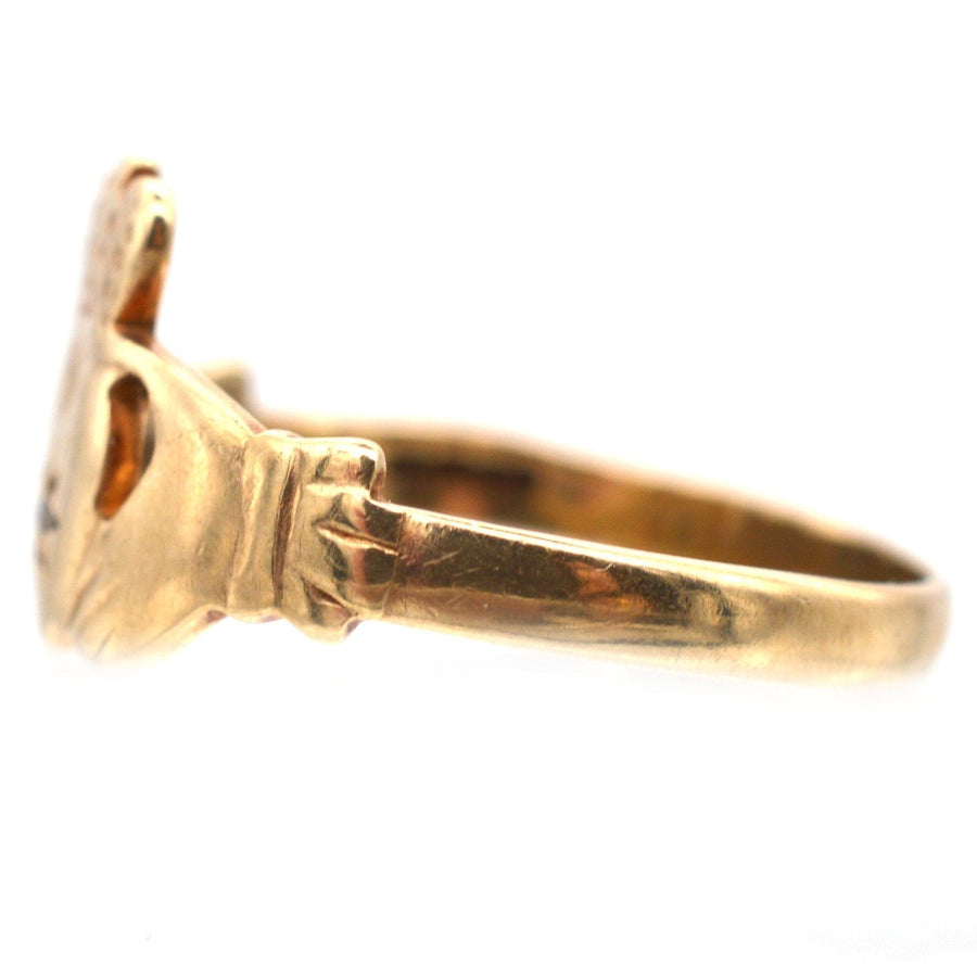 Vintage 9ct Irish Claddagh ring with diamond, showcasing intricate design and meaningful symbolism of love and loyalty.