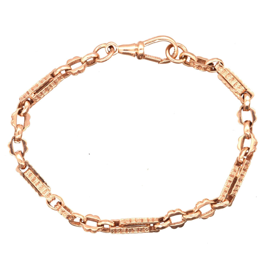 Vintage 9ct rose gold Albert chain bracelet with intricate link design and secure clasp.