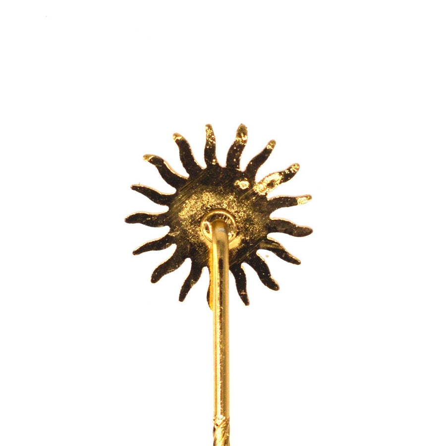 Vintage gold gilt metal sun tie pin with wavy rays, symbolizing light and heat.