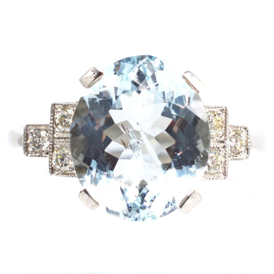Vintage platinum aquamarine ring with 3.6 carat oval stone and diamond shoulders. Ideal for engagement or cocktail occasions.