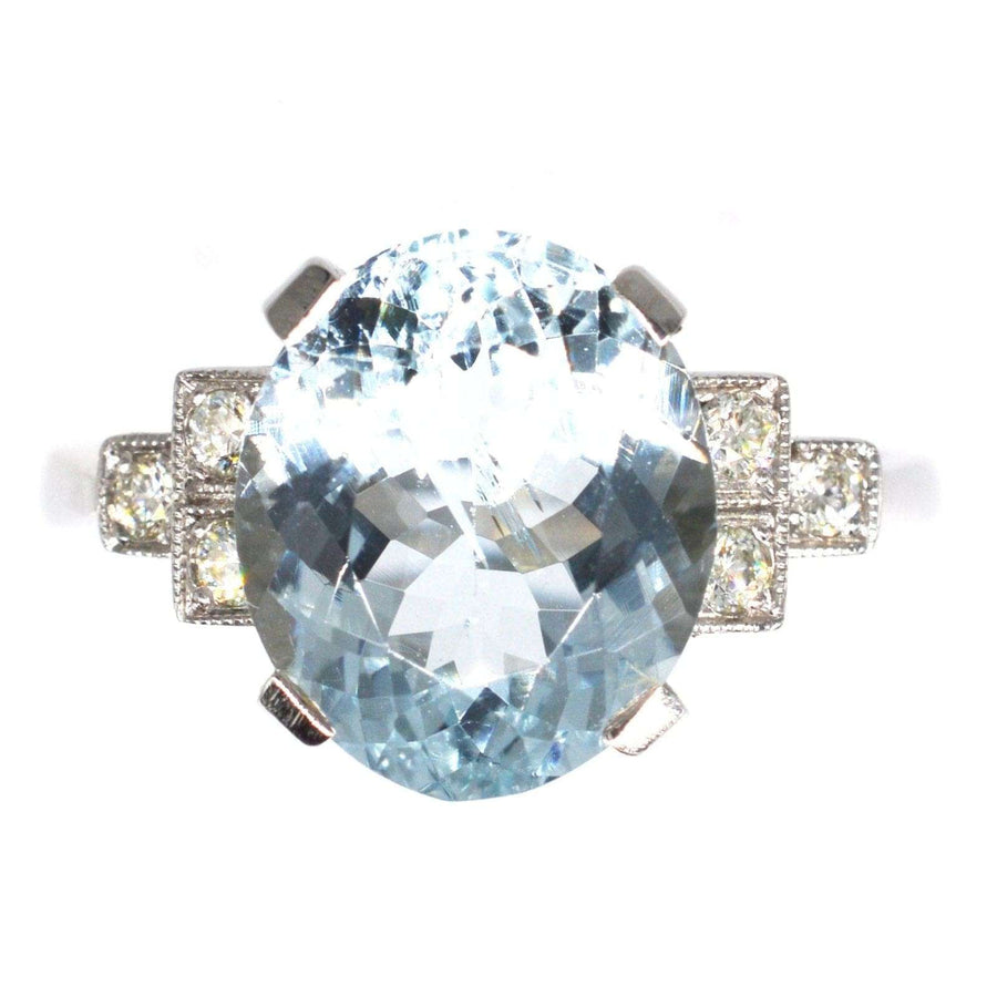 Vintage platinum aquamarine and diamond ring featuring a 3.6 carat light-blue oval aquamarine with diamond shoulders.