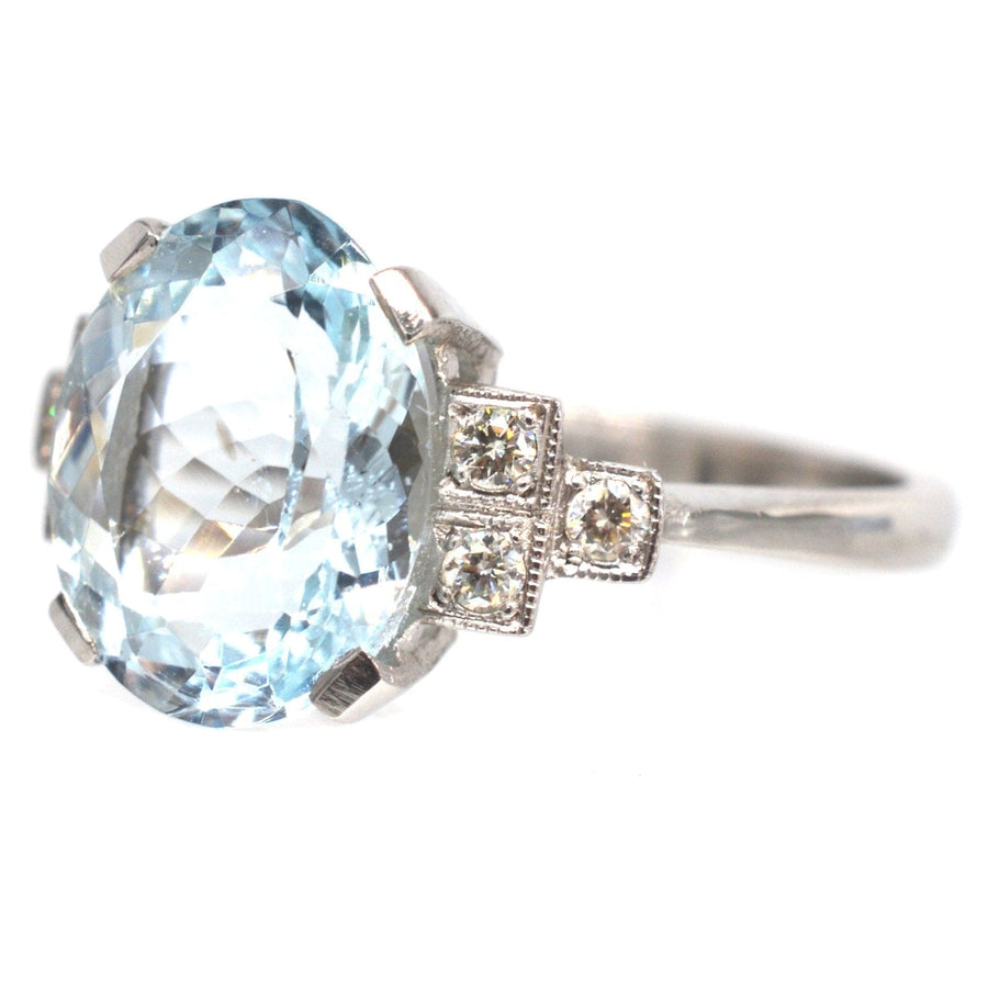 Vintage platinum ring featuring a 3.6 carat light blue aquamarine and diamond accents, ideal for engagement or cocktail wear.