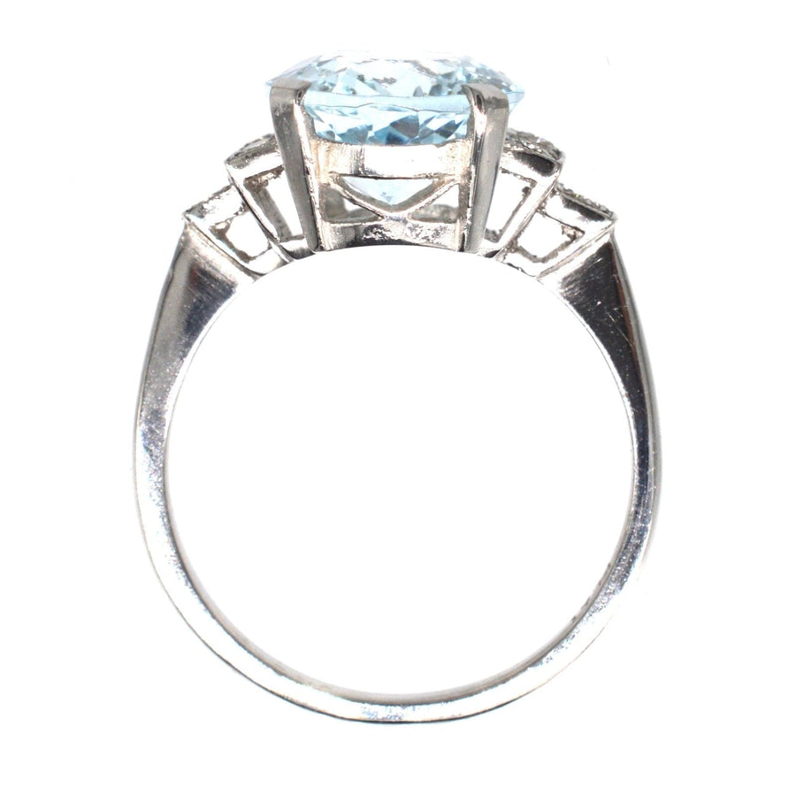 Vintage platinum aquamarine and diamond ring featuring a 3.6-carat light-blue oval aquamarine, perfect for engagement or cocktail occasions.