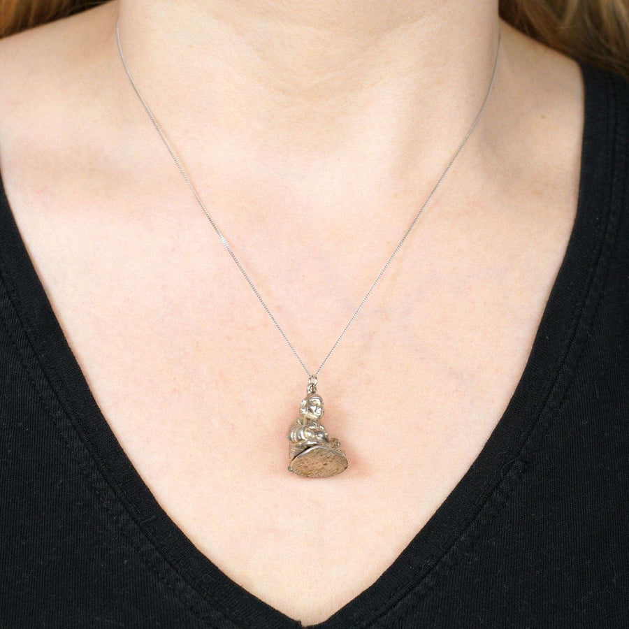 Vintage silver Buddha opening pendant worn on a silver chain, perfect for Buddhism enthusiasts and unique gifts.