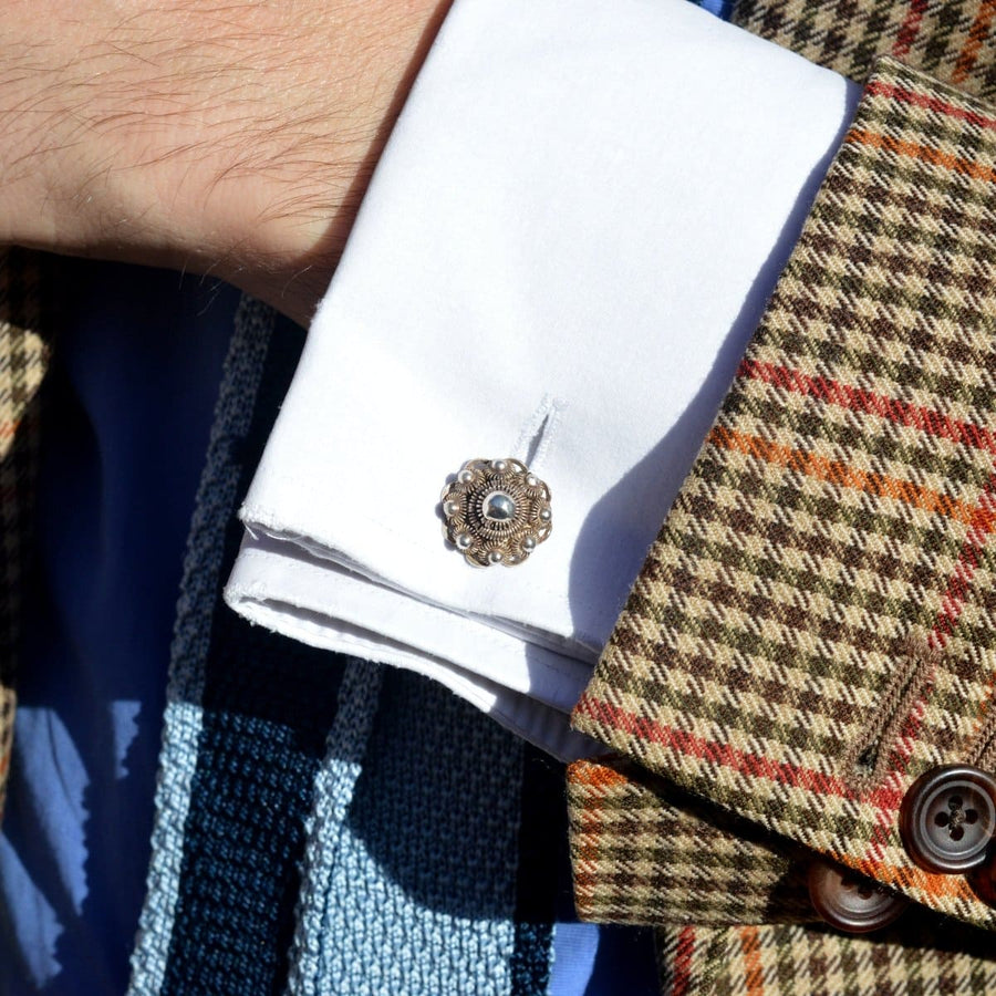 Vintage Silver Dutch cufflinks featuring dome-shaped filigree design on a white shirt cuff.