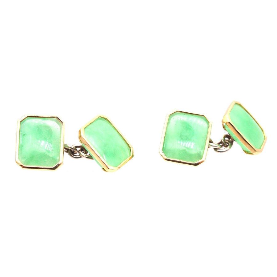 Vintage silver jade cufflinks featuring translucent green jadeite stones and yellow gold accents.