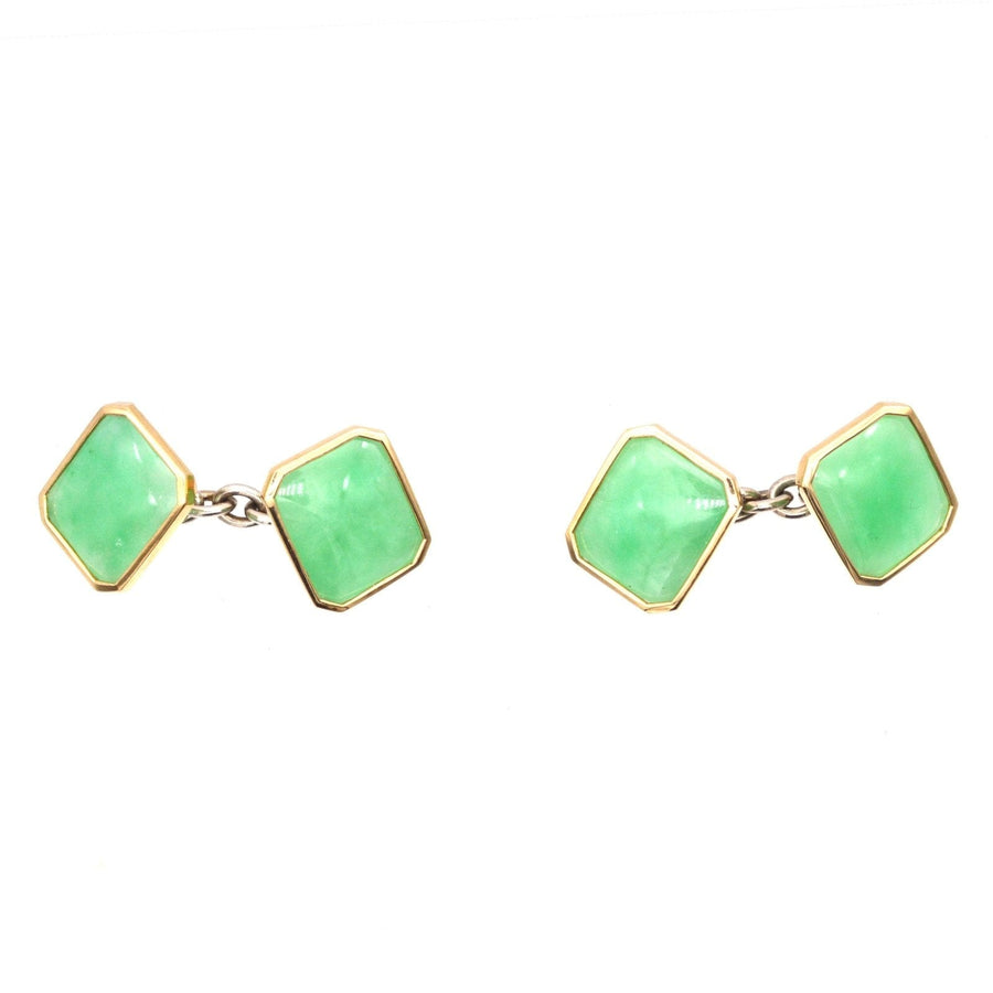 Vintage Art Deco silver and jade cufflinks featuring translucent green jadeite stones and yellow gold accents.