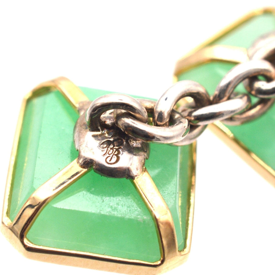 Vintage silver jade cufflinks featuring translucent green jadeite stones and yellow gold accents, stylish Art Deco design.