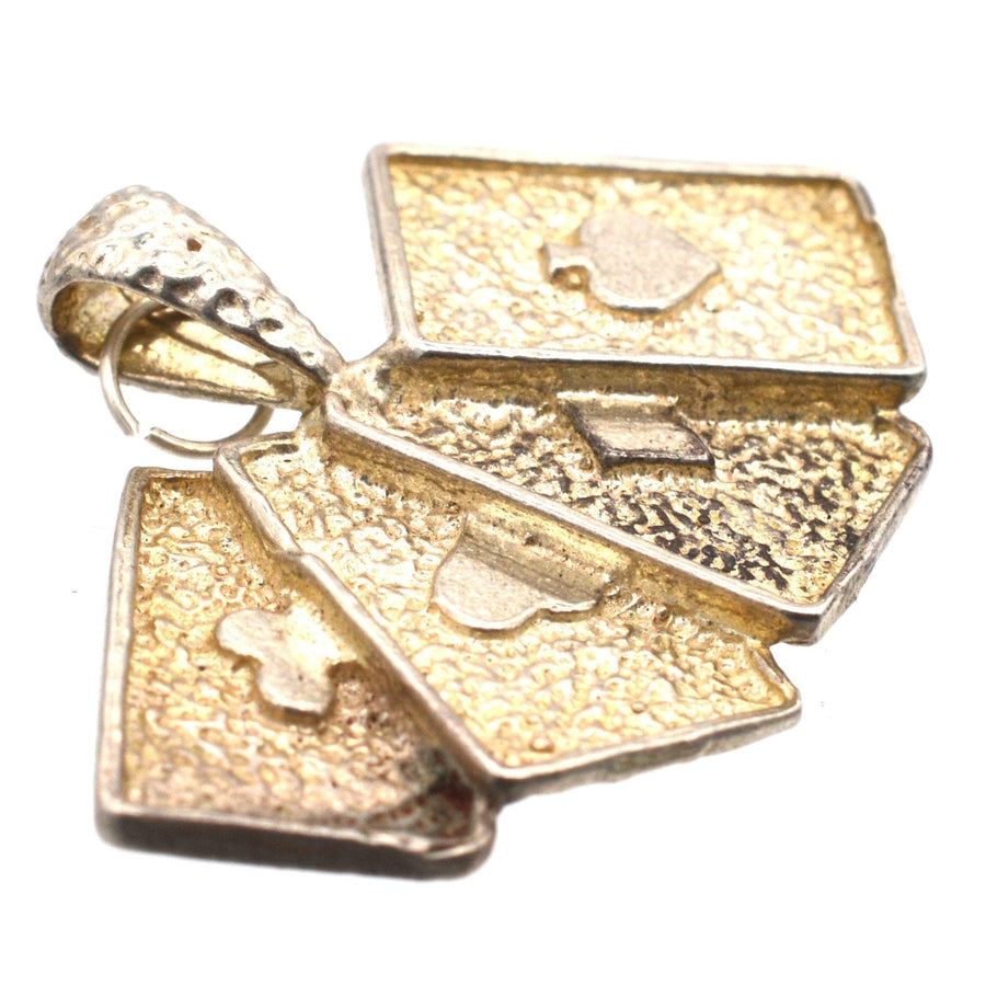 Vintage silver pendant featuring four aces playing cards: club, diamond, heart, and spade, perfect for poker lovers.