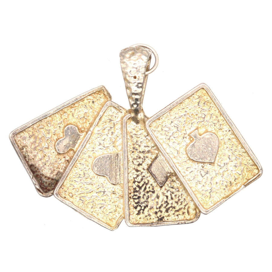 Vintage silver pendant featuring four aces playing cards: club, diamond, heart, and spade, ideal for card game enthusiasts.