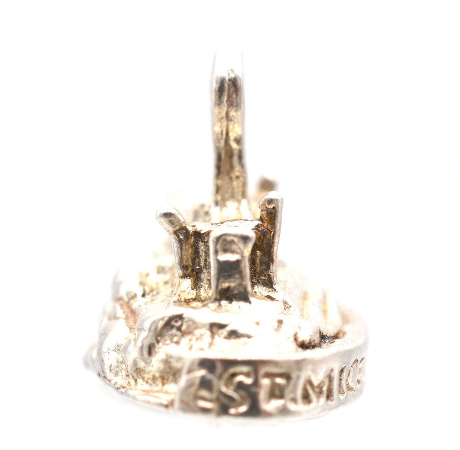 Vintage silver charm pendant of St Michael's Mount, showcasing detailed medieval castle design.