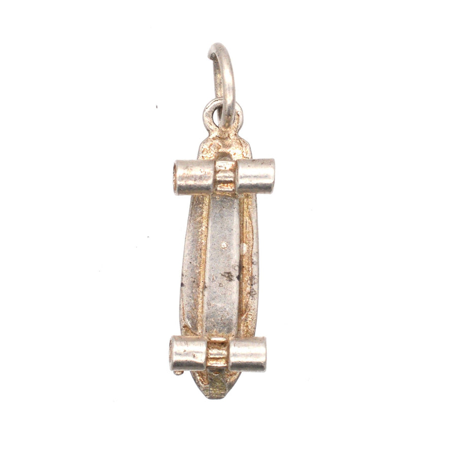 Vintage silver skateboard pendant charm, showcasing a detailed skateboard design, perfect for charm bracelets.