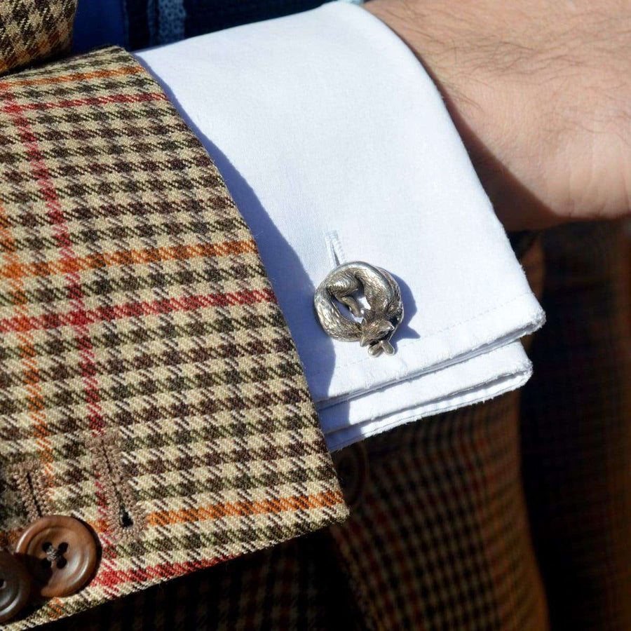 Vintage silver sleeping fox cufflinks worn on a white dress shirt with a houndstooth blazer.