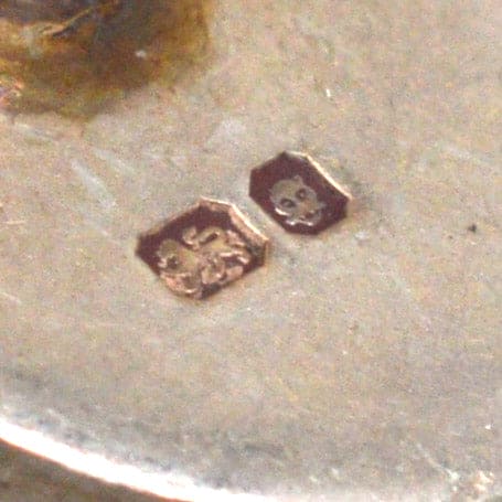 Close-up of hallmark stamps on vintage silver cufflinks by Lexi Dick, showcasing craftsmanship and authenticity.