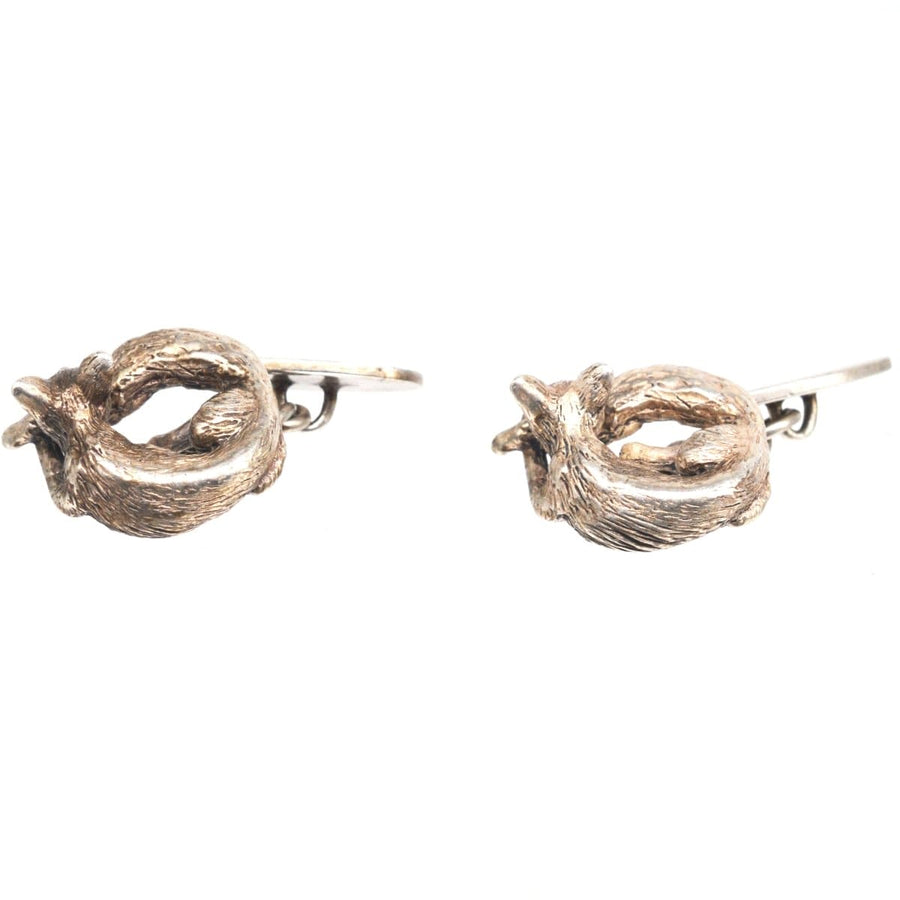 Vintage silver cufflinks featuring charming sleeping foxes by Lexi Dick, crafted in 1985 using lost wax method.