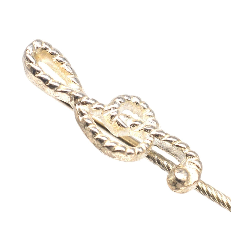Vintage silver treble clef tie pin with rope detail, ideal for music lovers and stylish accessories.