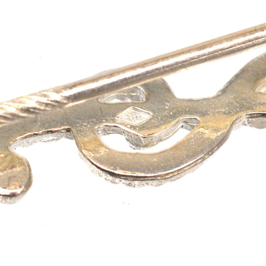 Vintage silver treble clef tie pin with rope detail, perfect for music lovers and musicians.