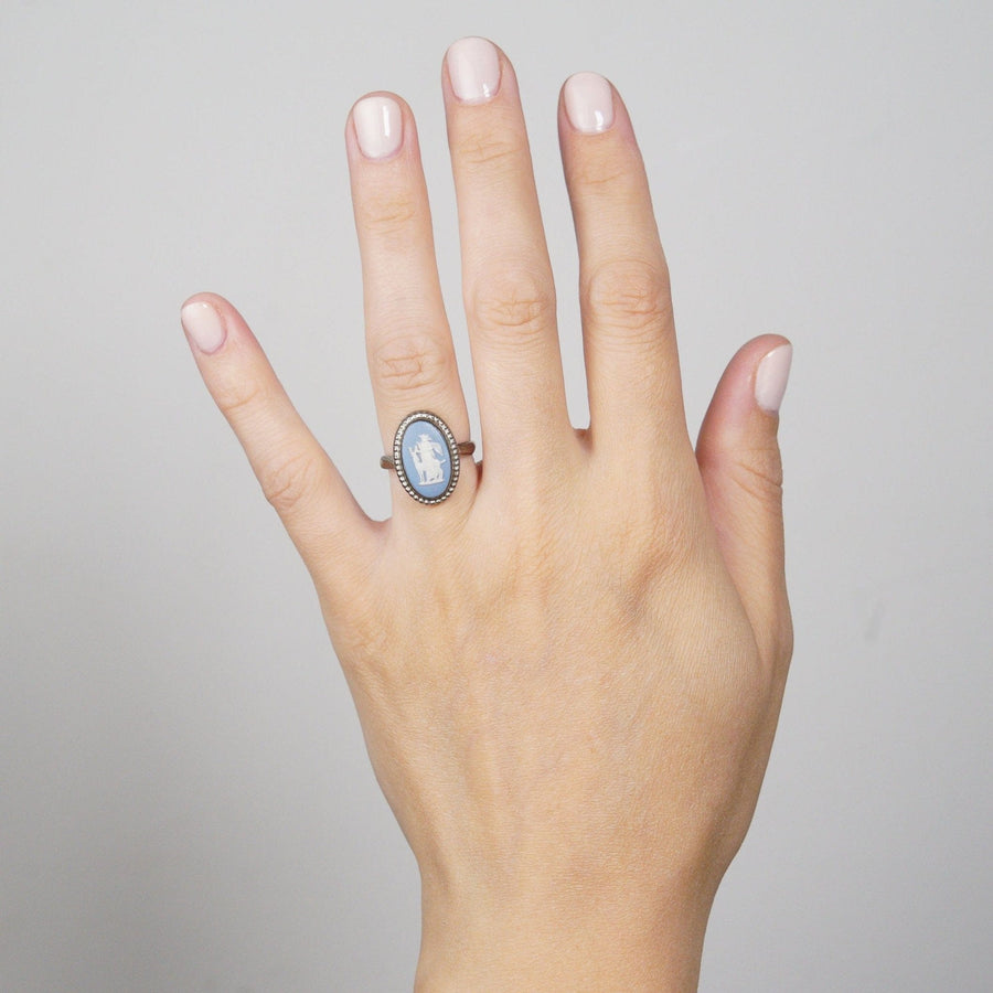 Vintage silver Wedgwood plaque ring featuring Diana the Huntress design displayed on a hand.