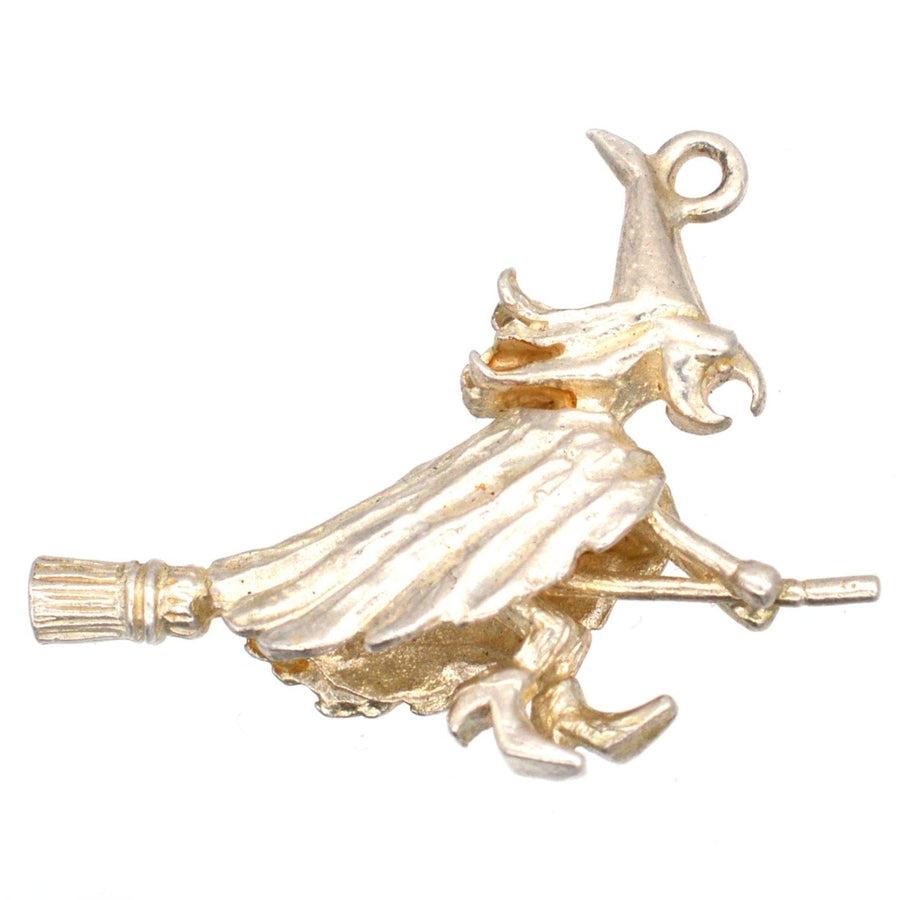 Vintage silver witch pendant on broomstick, perfect for Halloween or gifting to someone special.