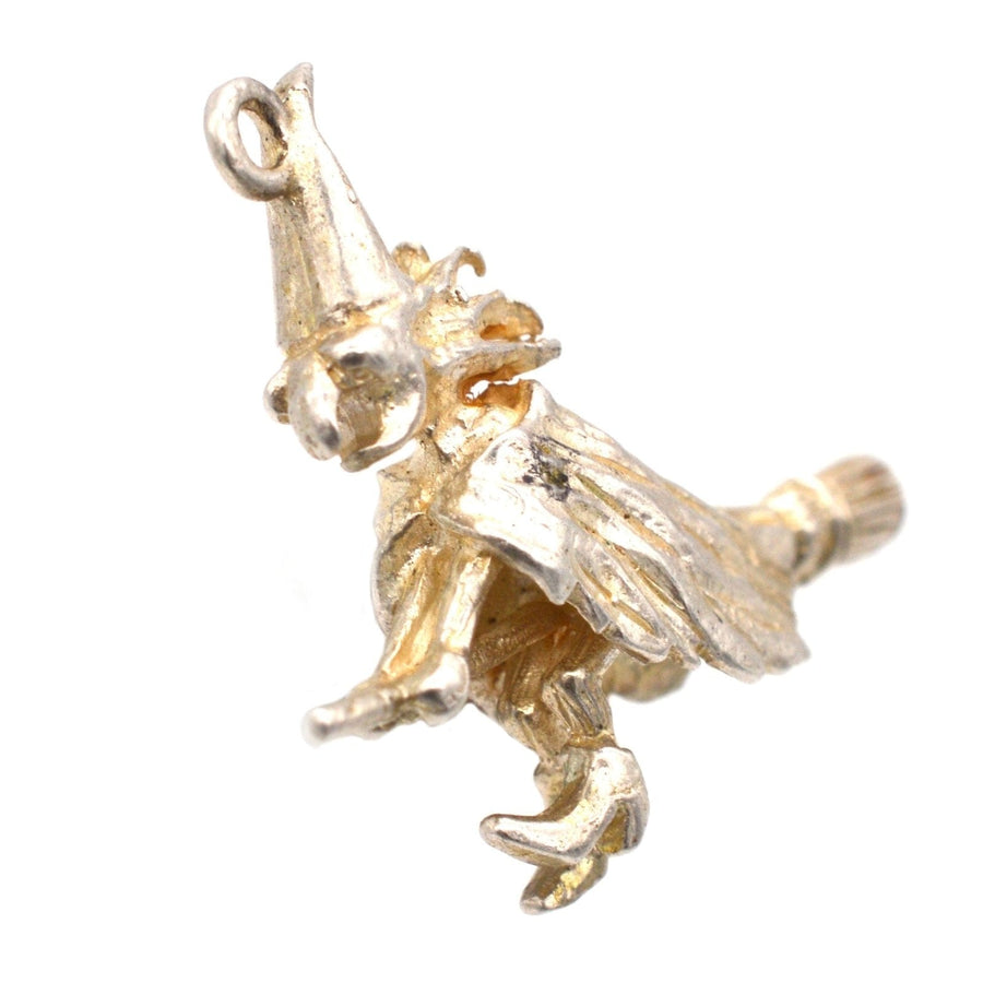 Vintage silver witch on broomstick pendant from the 1970s, perfect for Halloween or as a charming gift.