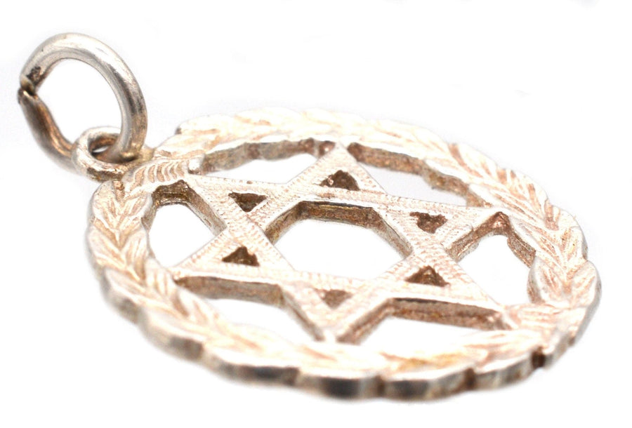 Silver Star of David pendant surrounded by a laurel wreath, symbolizing Jewish heritage and honor.