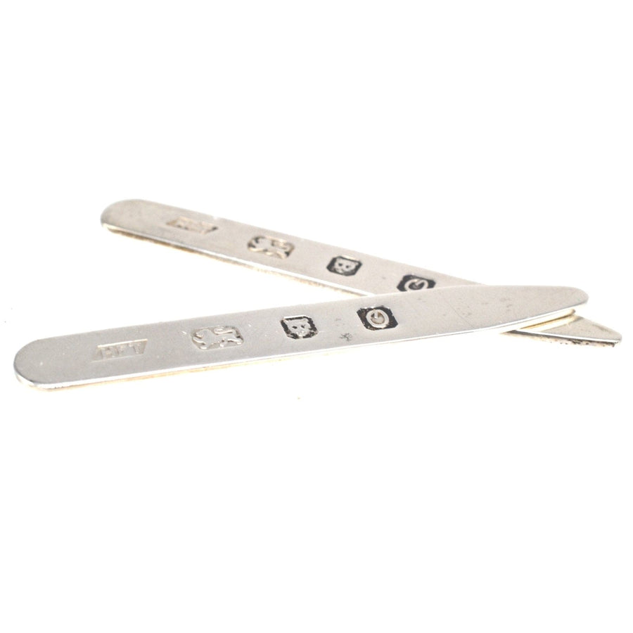 Vintage sterling silver shirt collar stiffeners crafted in London, perfect for a polished and professional look.