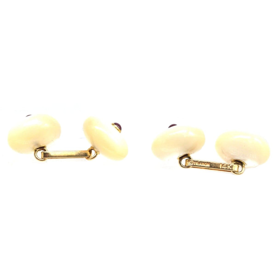Vintage 14ct gold cufflinks with carved mother of pearl and ruby, showcasing elegant 1950s style.