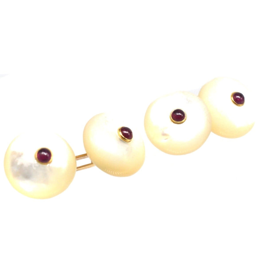 Vintage Trianon 14ct gold cufflinks with oval mother of pearl and round cabochon ruby accents.